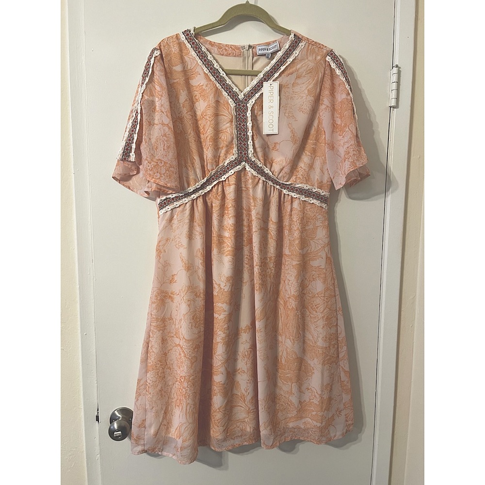 The Kenley detail empire waist in peach.